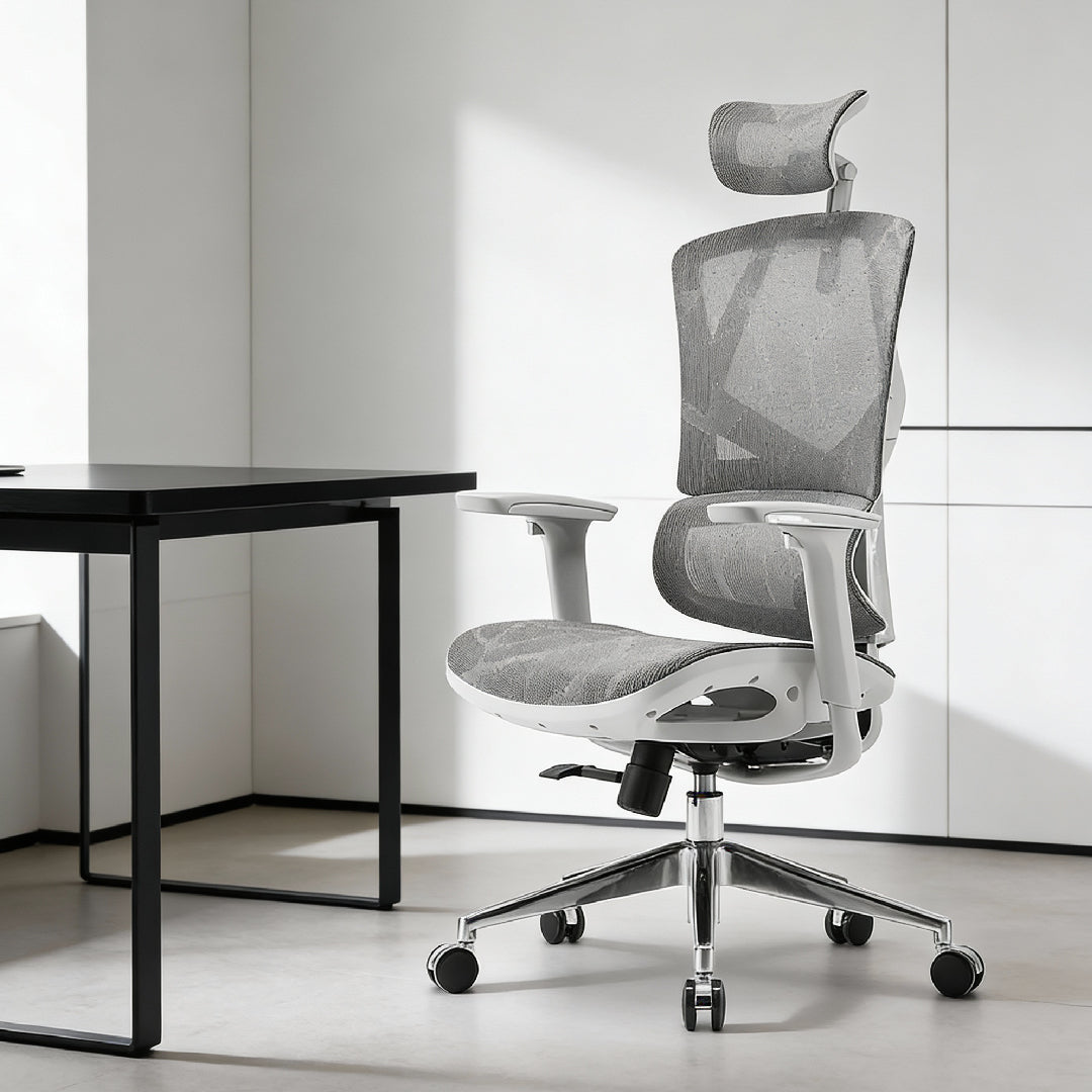 Ergonomic high-back mesh office chair with adjustable headrest and lumbar support in a modern home office setting.