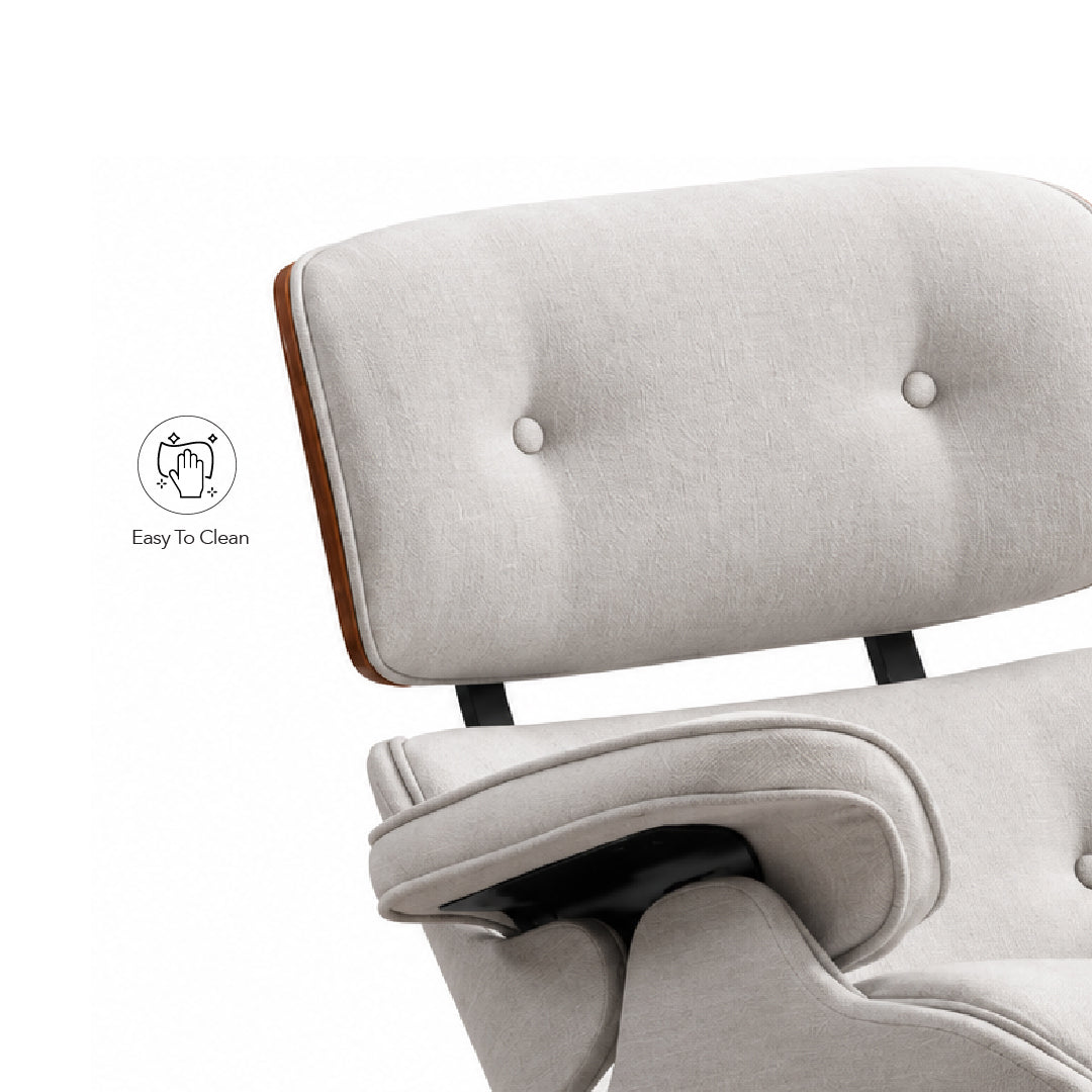 Close-up of a light beige upholstered lounge chair with tufted backrest, wooden side trim, and black metal support legs on a white background. A small 'Easy To Clean' icon appears to the left.