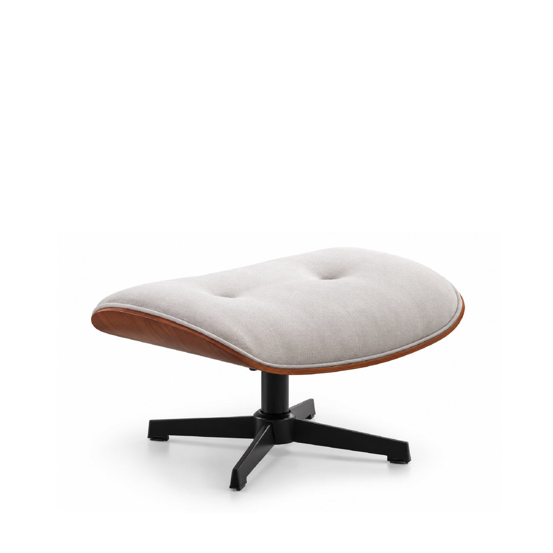 A modern lounge ottoman with a tufted light beige fabric cushion, a curved medium-brown wood shell, and a black swivel base, shown on a clean white background.