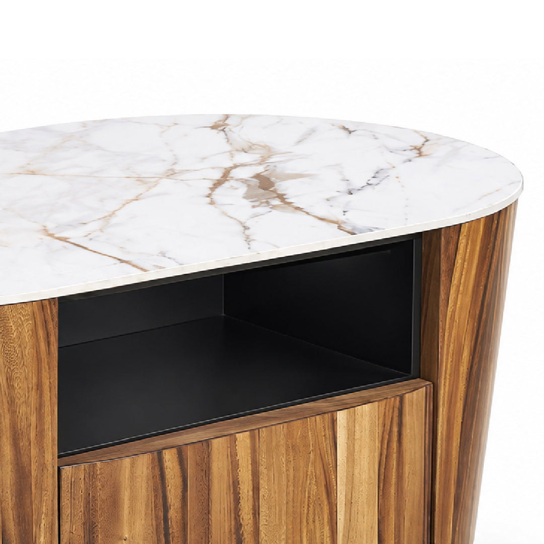 Close-up of a modern coffee table with a white marble top, warm brown wood grain sides and lower cabinet, and a black open shelf interior.
