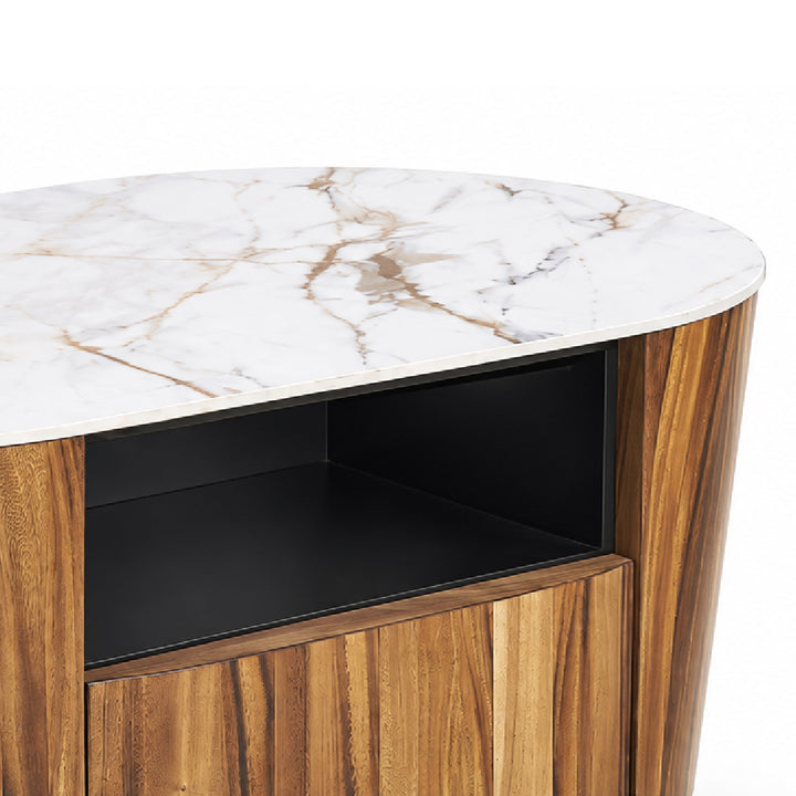 Close-up of a modern coffee table with a white marble top, warm brown wood grain sides and lower cabinet, and a black open shelf interior.