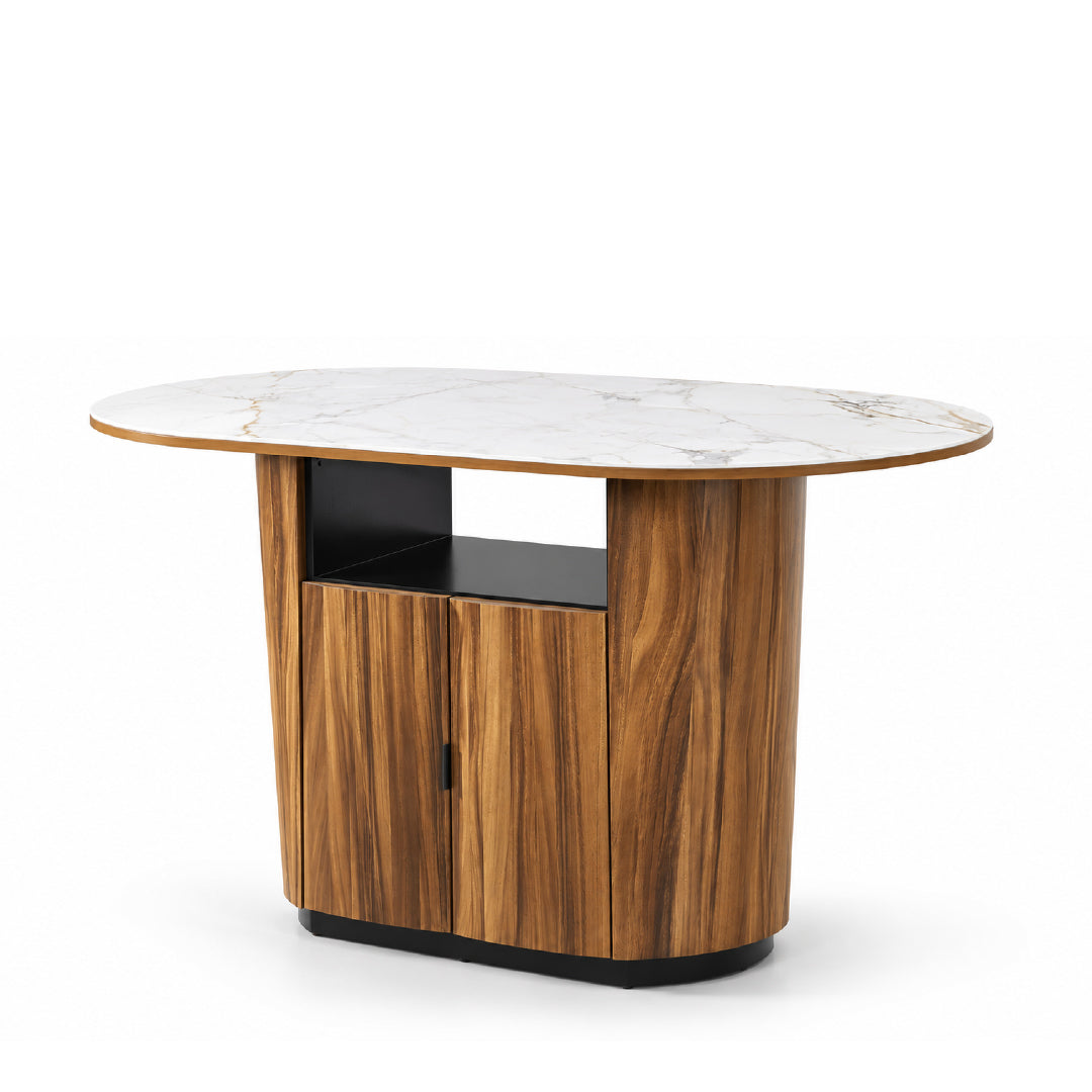 An oval-shaped modern island table featuring a white sintered stone top with subtle gray veining, a warm brown solid rubberwood and monkey pod wood veneer cabinet base, including an opened shelf and base trim, shown on a solid white background at slight angled view.