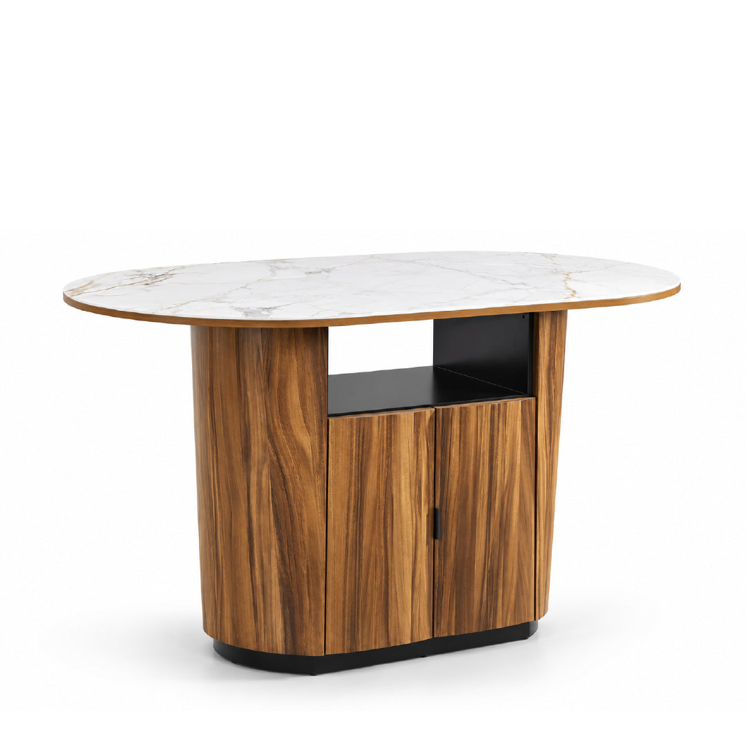 An oval-shaped modern island table featuring a white sintered stone top with subtle gray veining, a warm brown solid rubberwood and monkey pod wood veneer cabinet base, including an opened shelf and base trim, shown on a solid white background at slight angled view.