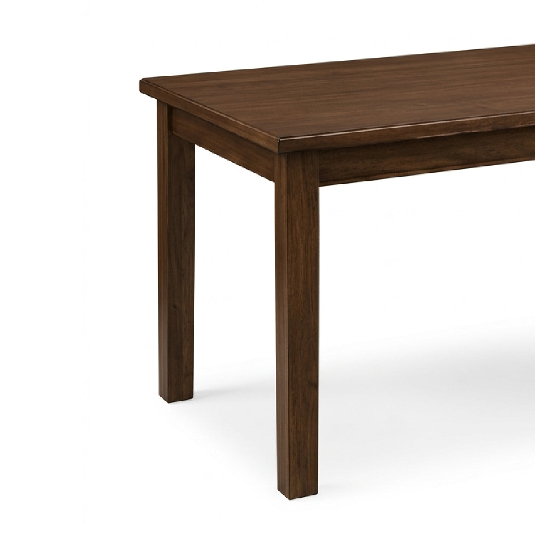 A close-up of a dark brown wooden table showing the tabletop and front-left leg against a clean white background.