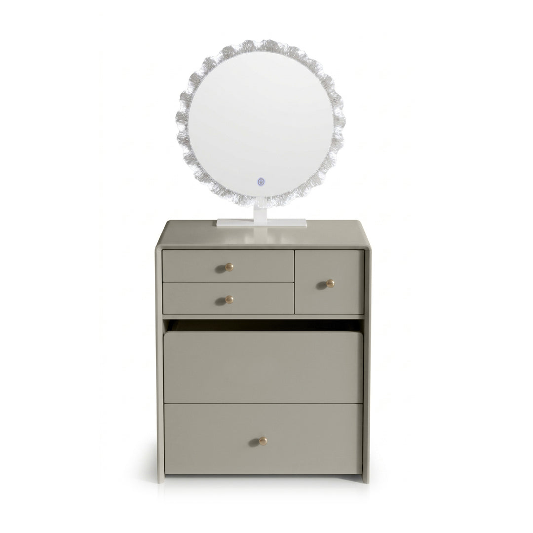A light gray vanity cabinet with three drawers, a round mirror with a textured silver frame, and small gold knobs, shown on a white background.
