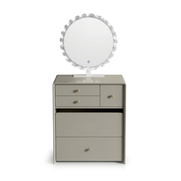 A light gray vanity cabinet with three drawers, a round mirror with a textured silver frame, and small gold knobs, shown on a white background.