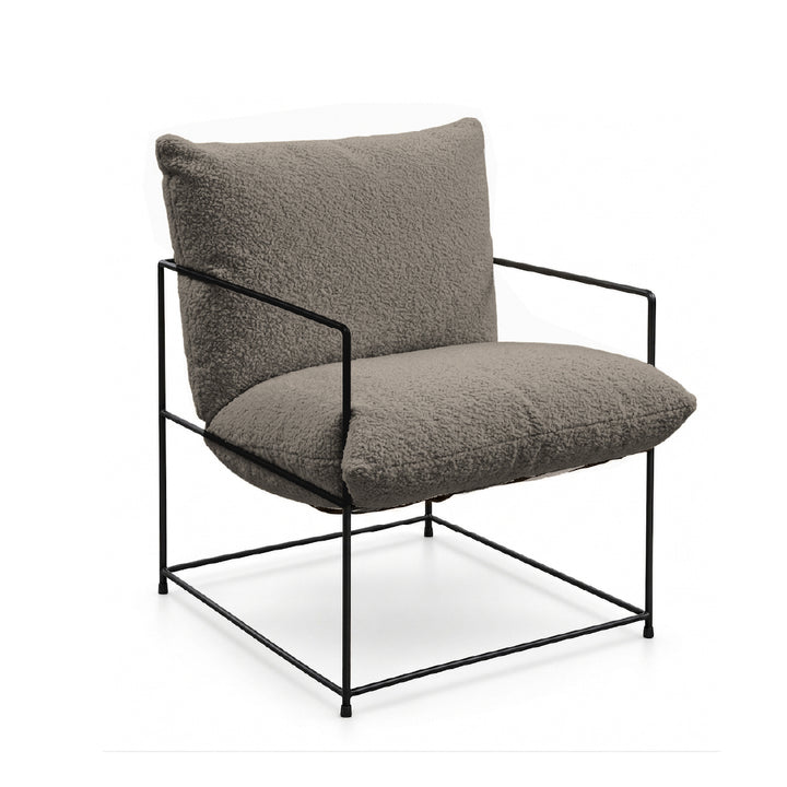 A modern accent chair with a black metal frame and plush, textured gray bouclé cushions on a white background.