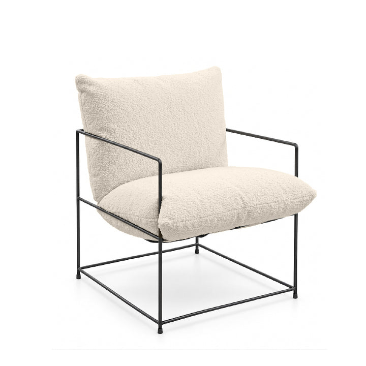 A modern accent chair featuring textured cream bouclé cushions on a black metal frame, shown against a plain white background.