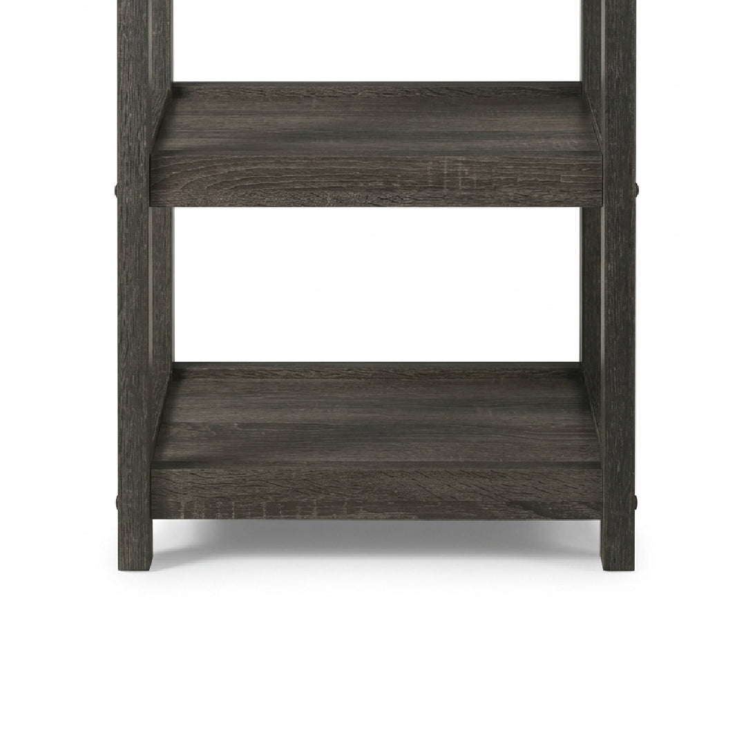 A close-up of a dark gray wood shelving unit showing two levels with a weathered, rustic finish on a white background.