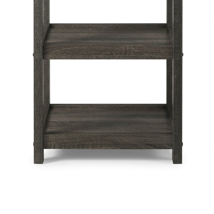 A close-up of a dark gray wood shelving unit showing two levels with a weathered, rustic finish on a white background.