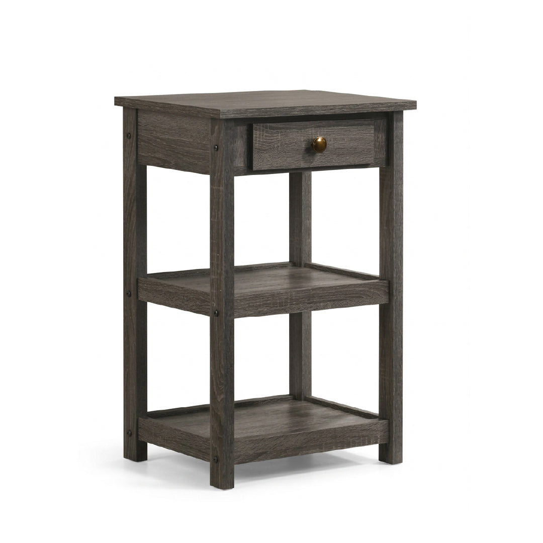 A three-tier side table with a dark gray wood grain finish, featuring a single drawer with a small brass knob on the top shelf, set against a plain white background.