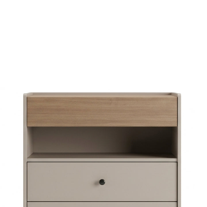 A modern two-tone storage cabinet with a light oak wood top drawer and a matte beige lower drawer with a small round black knob, shown against a plain white background.