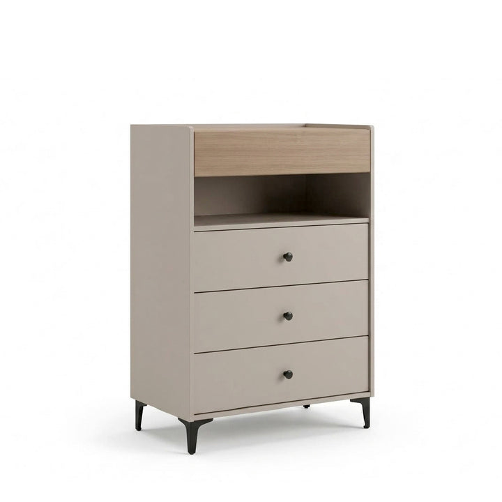 A modern three-drawer dresser with a light wood top panel, three beige drawers with small round black knobs, and black tapered legs, shown on a white background.