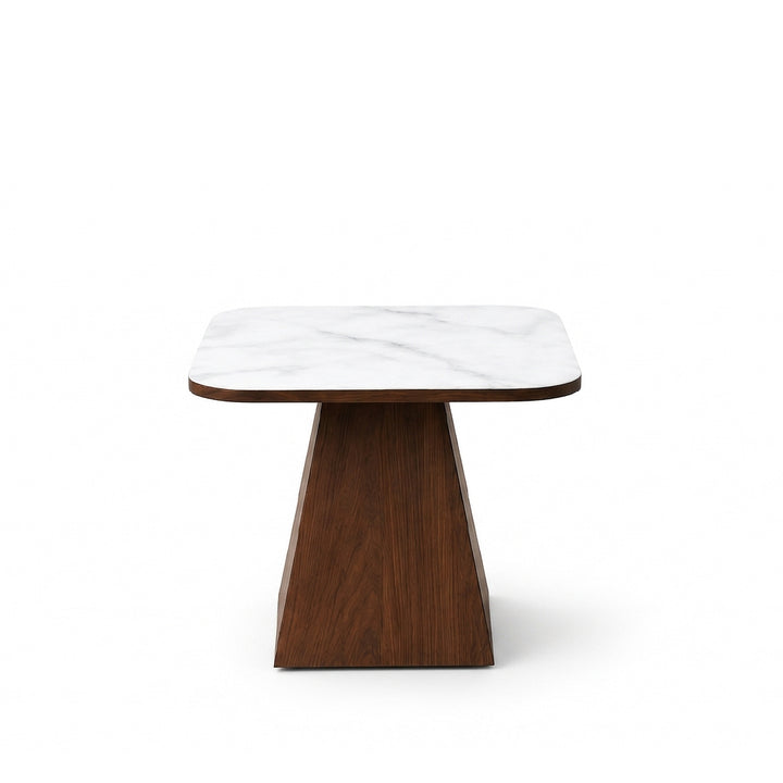 A modern square side table featuring a white marble top with subtle gray veining and a sculptural dark brown wooden pedestal base, shown on a solid white background.