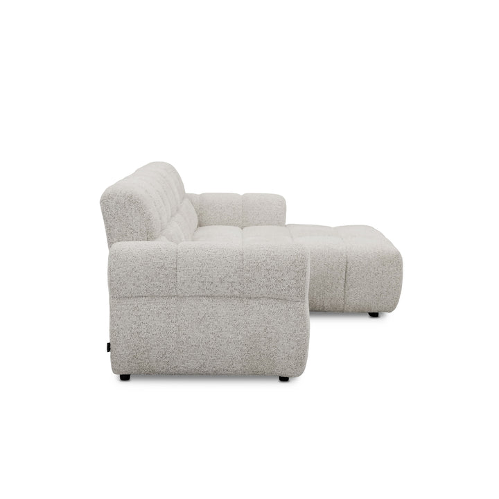 A light grey bouclé sectional sofa with a right-facing chaise lounge, shown from a side profile view against a solid white background.