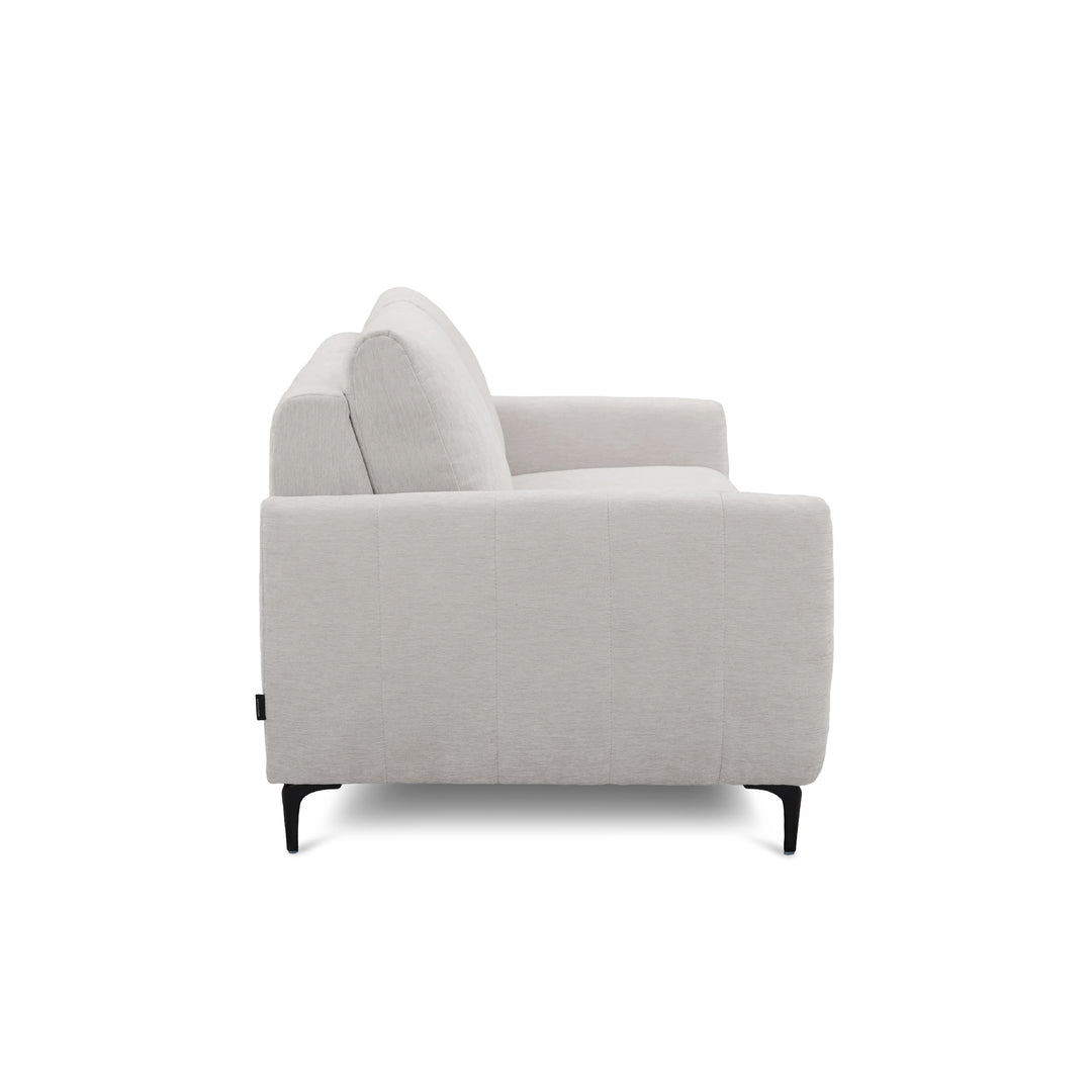 A light khaki upholstered armchair shown from a side angle against a plain white background.