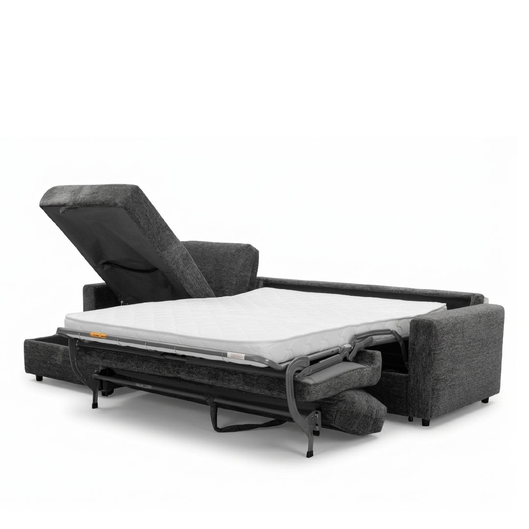 A dark gray upholstered sofa bed shown in a partially extended position, with a white mattress on top and the headrest raised, photographed on a clean white studio background.