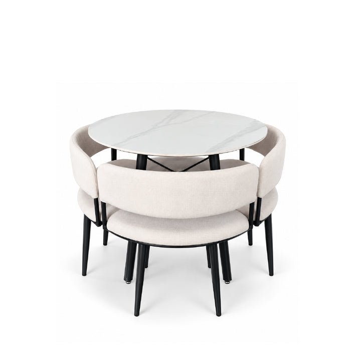 A modern round dining table with a white marble-look top and four upholstered chairs in a light beige fabric, all with black legs, shown on a white background.