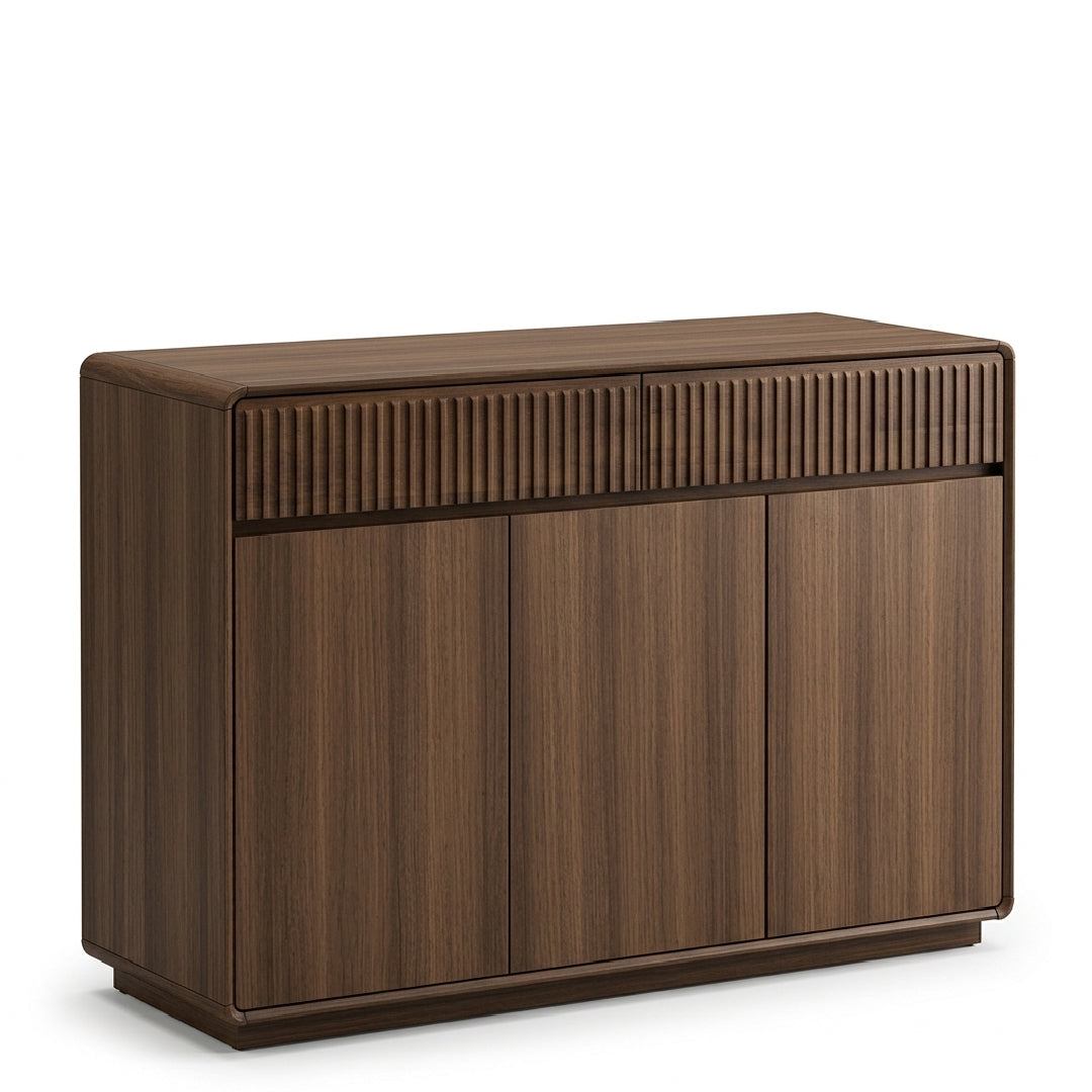A modern wooden sideboard or credenza with a dark brown walnut finish, featuring three front doors and two ribbed drawer fronts on the top, shown against a plain white background.